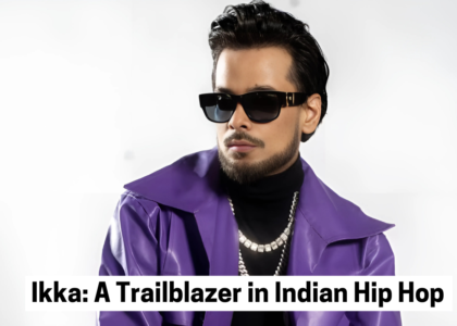 A portrait of Indian rapper Ikka wearing a purple jacket, black turtleneck, and sunglasses, exuding confidence with a stylish look