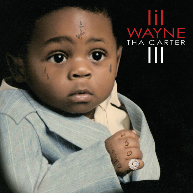 Tha Carter III album cover featuring a baby with Lil Wayne's signature tattoos, wearing a suit
